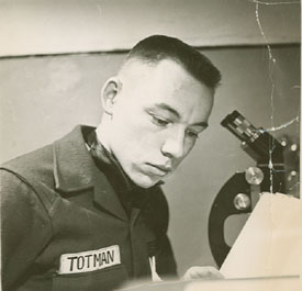 Totman at his microscope