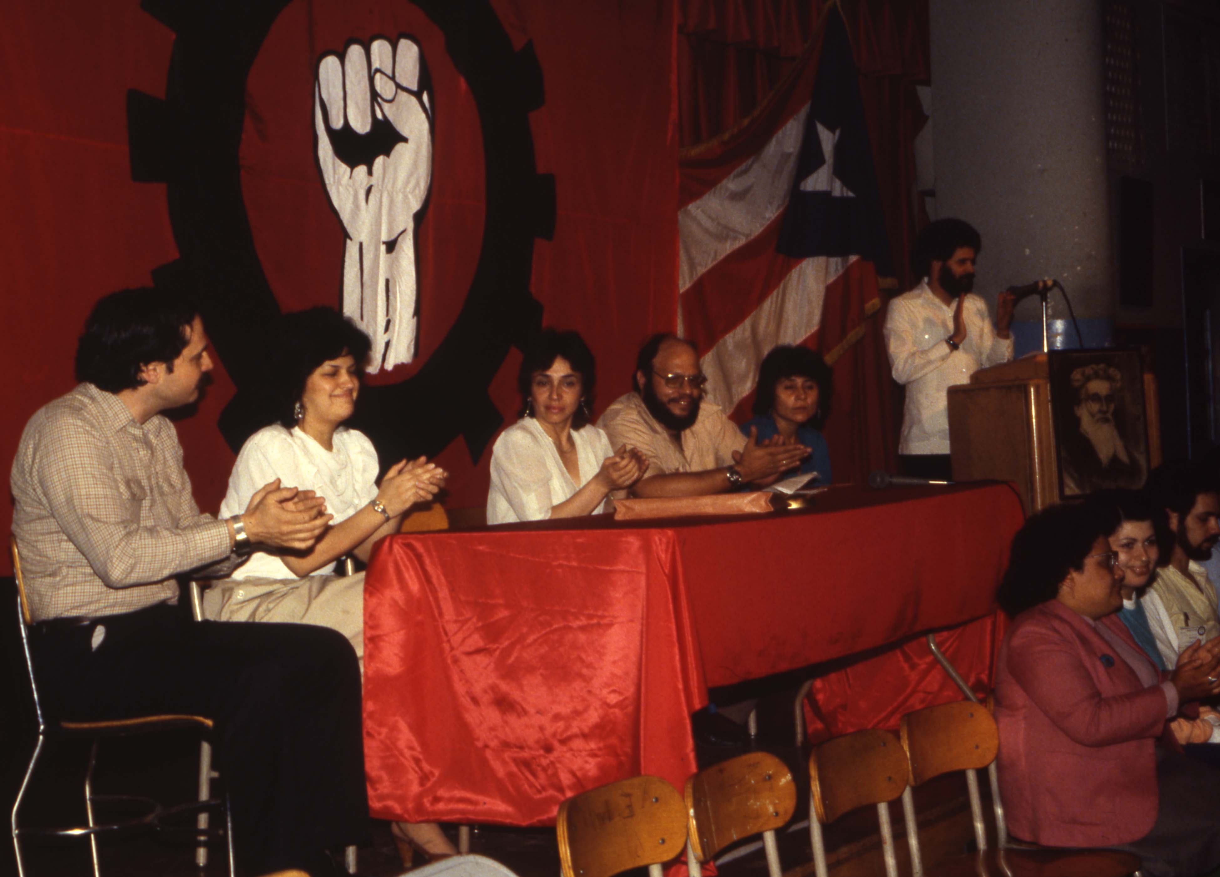 
An image of: José Soler, seated second from the right, at the 1983 Congress of the United States section of the Partido Socialista Puertorriqueño (PSP).