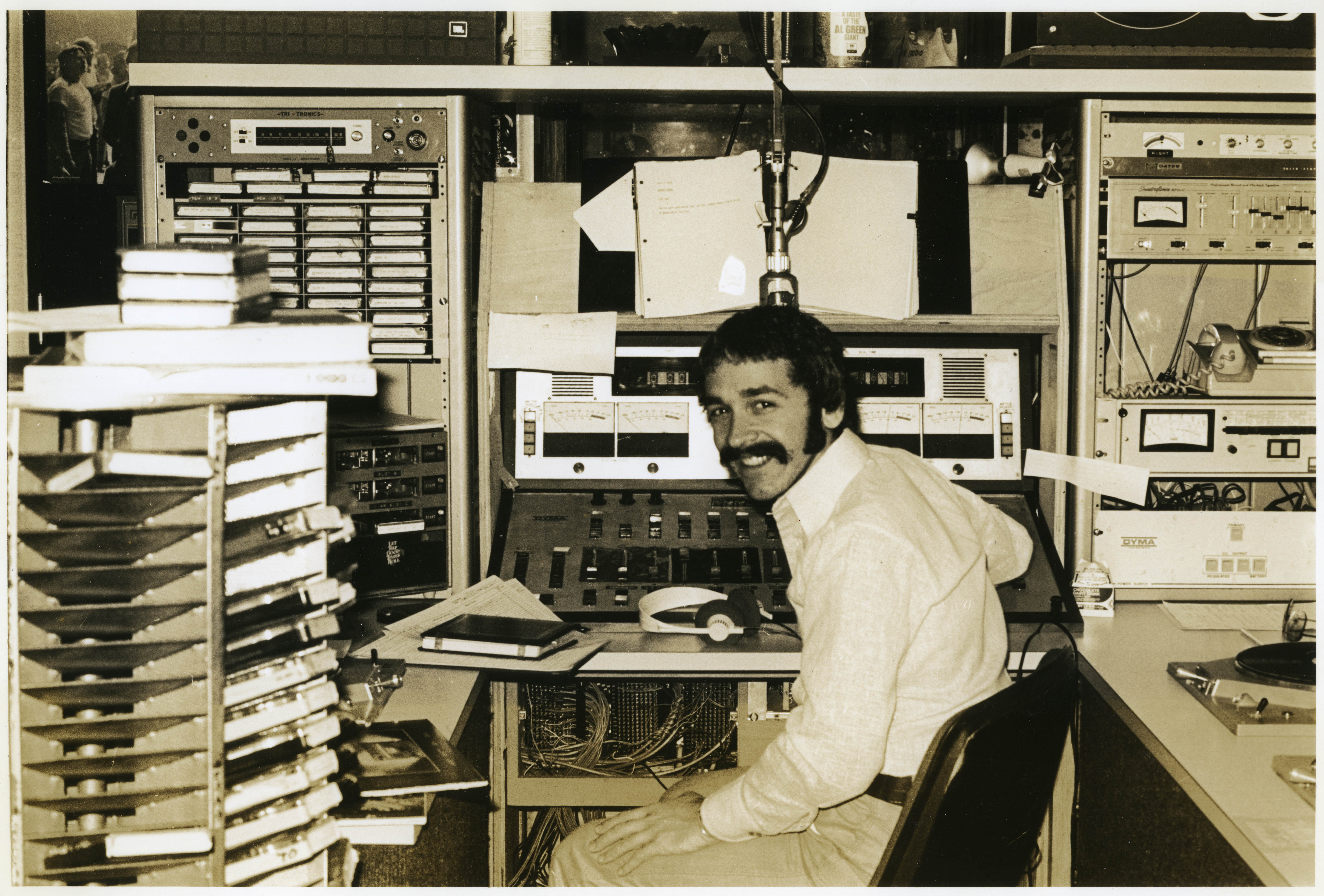 Depiction of Tommy Hadges at the WBCN studios in the Prudential Center, ca. 1976