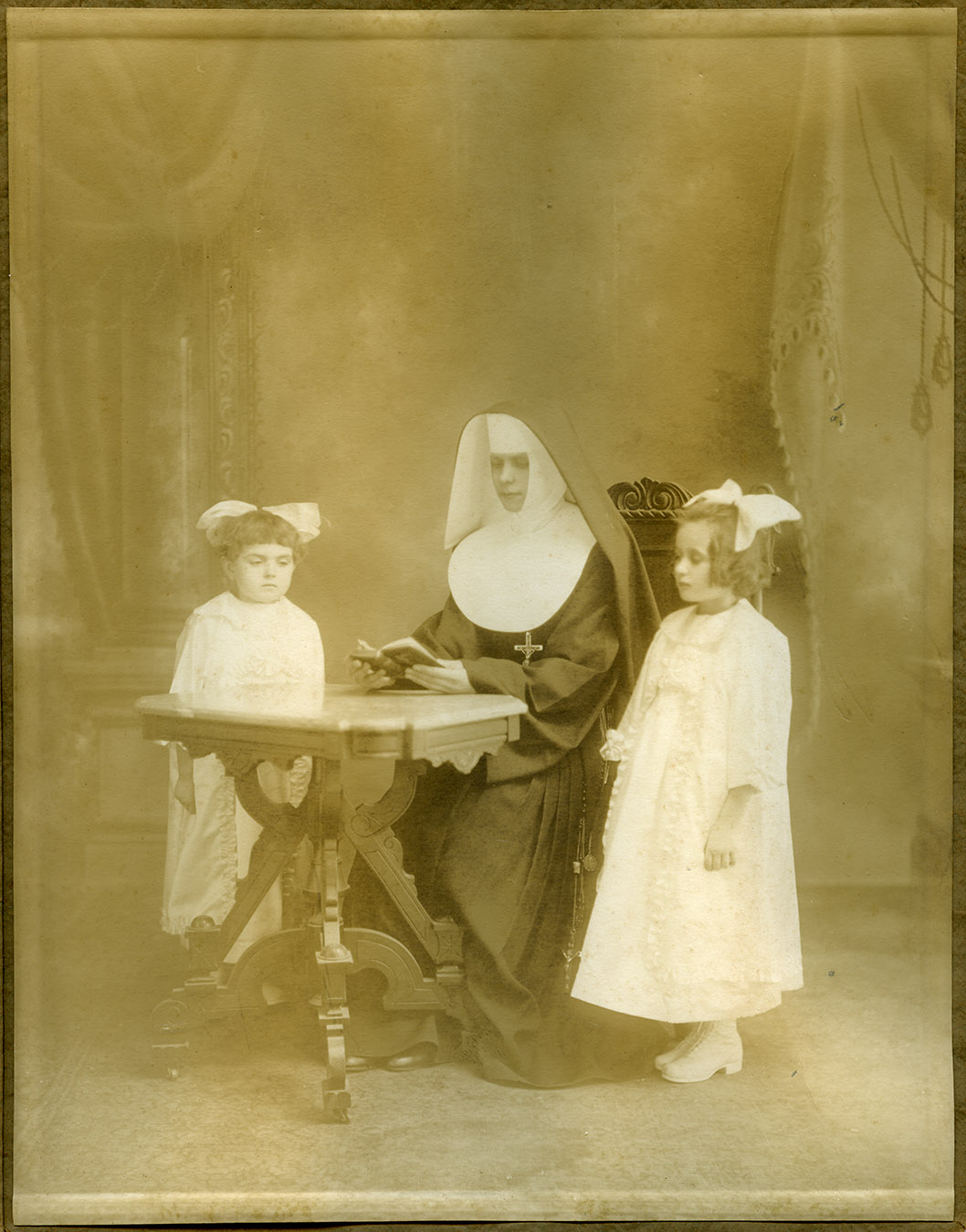 Depiction of Nun and two girls at first communion, ca.1920