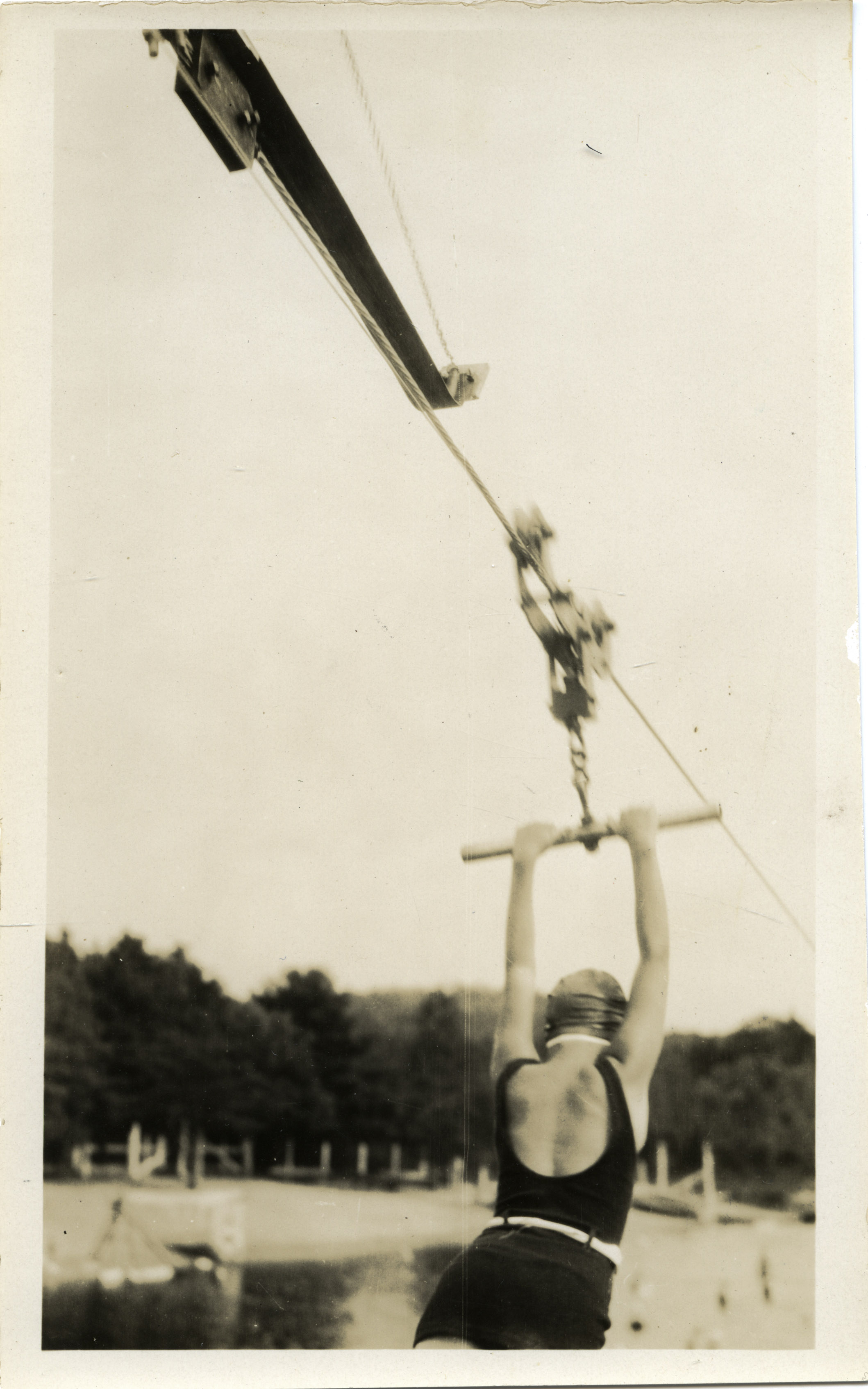 Depiction of Woman on a zip line at Lake Rohunta, ca.1925