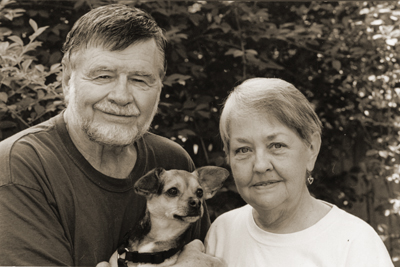 Depiction of Bob and Martha Perske with their dog, Wolfie, 2004
