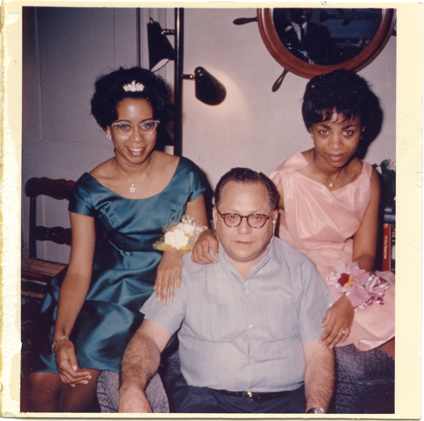 Depiction of Bernie Moss with two unidentified women in Moss's home, 1962
