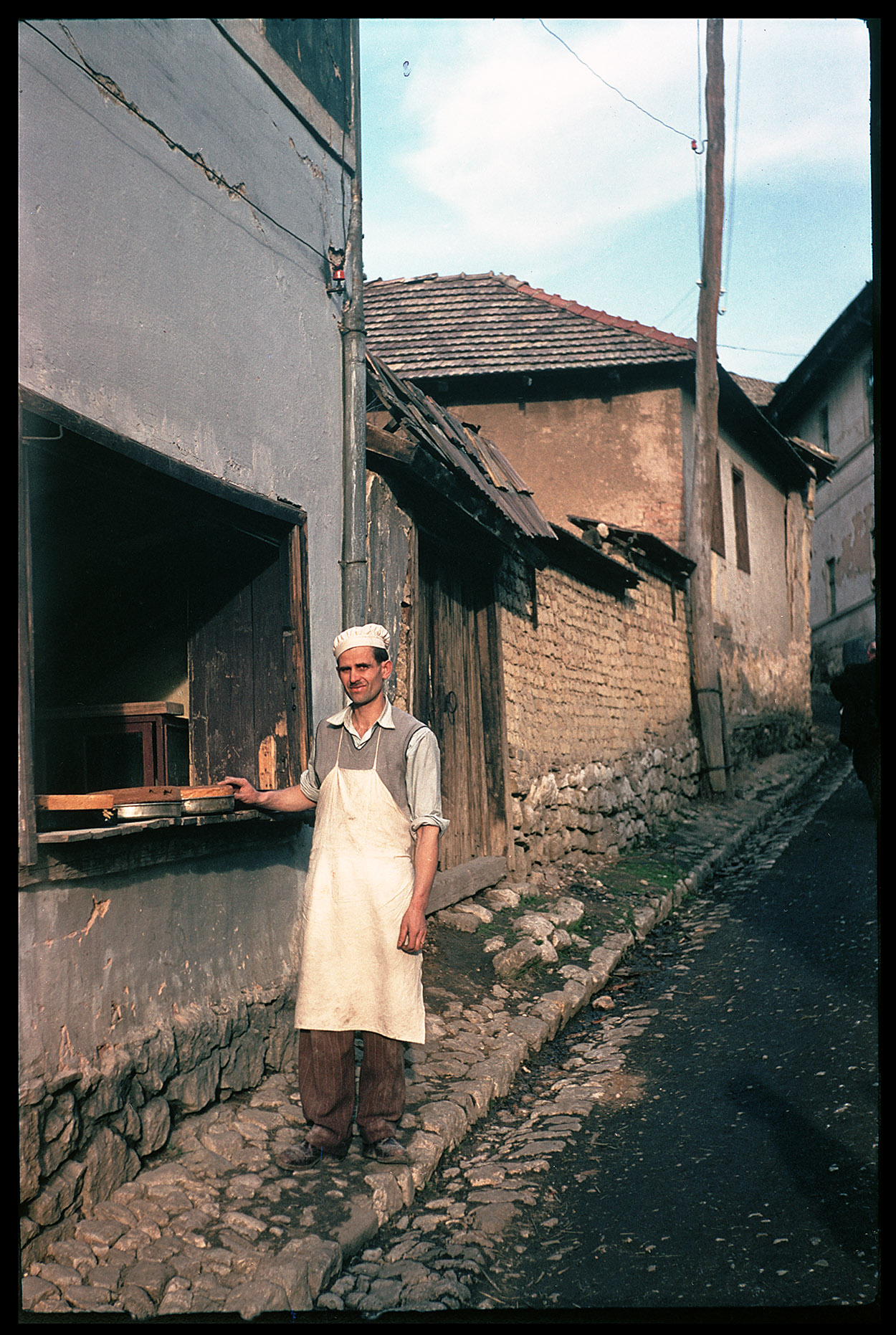 Depiction of Bosnian baker at his shop, ca.1955