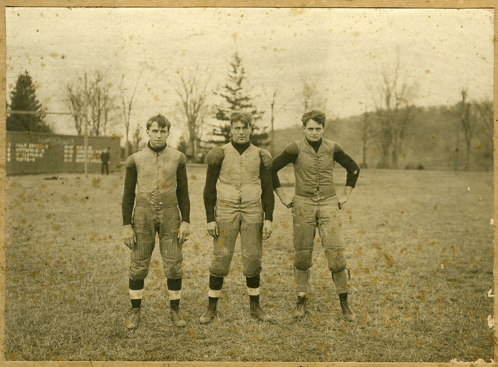 Depiction of Chet Whitaker, Bill Munson, Chick Lewis (football players)