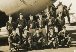 Russell Stacy and his WII Squadron in front of aircraft, ca. 1942