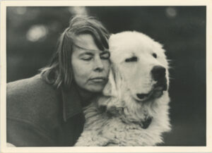 Ann Stokes hugging Nanette the large white dog, 1972