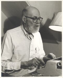 Allen Whiting at his typewriter.
