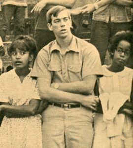 Tom Gardner holding hands with two black women at a civil rights rally