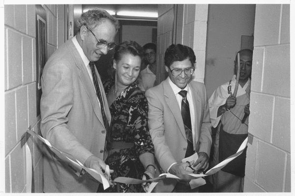 Richard O'Brien cutting a ribbon